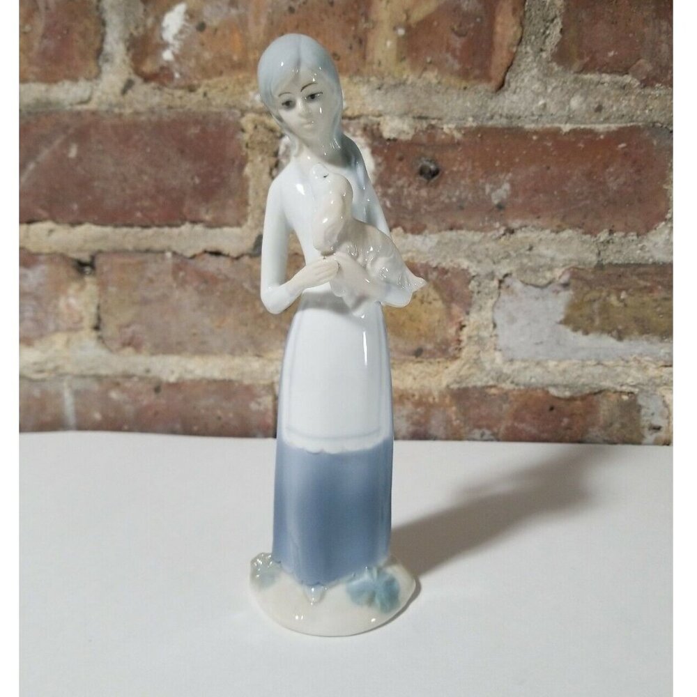 Glass figurine Girl Holding Dog Light Blue And White. Good Condition